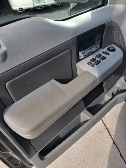 Before and after car detailing transformation showing interior carpet and upholstery deep cleaning results