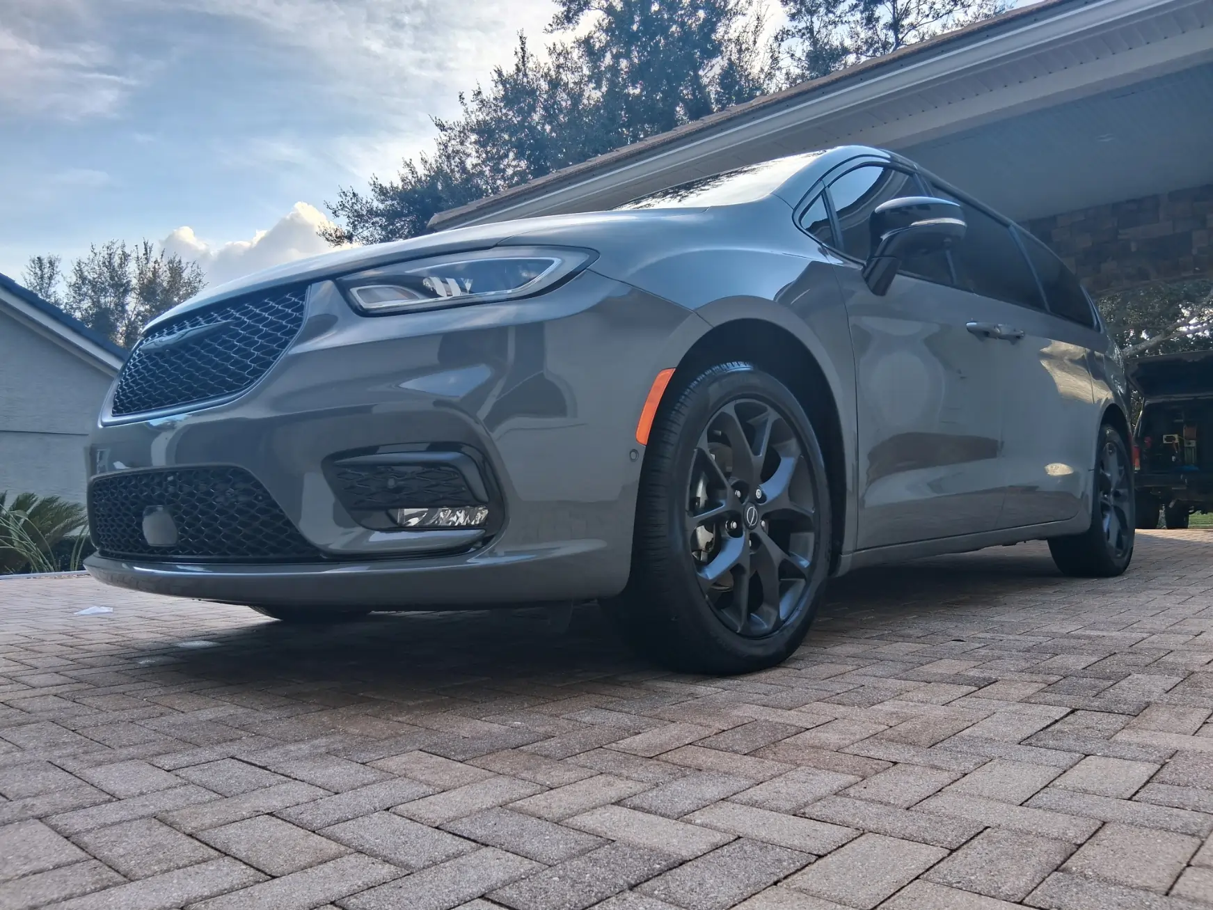 Modern gray Chrysler Pacifica exterior detailing with ceramic coating and tire shine finish