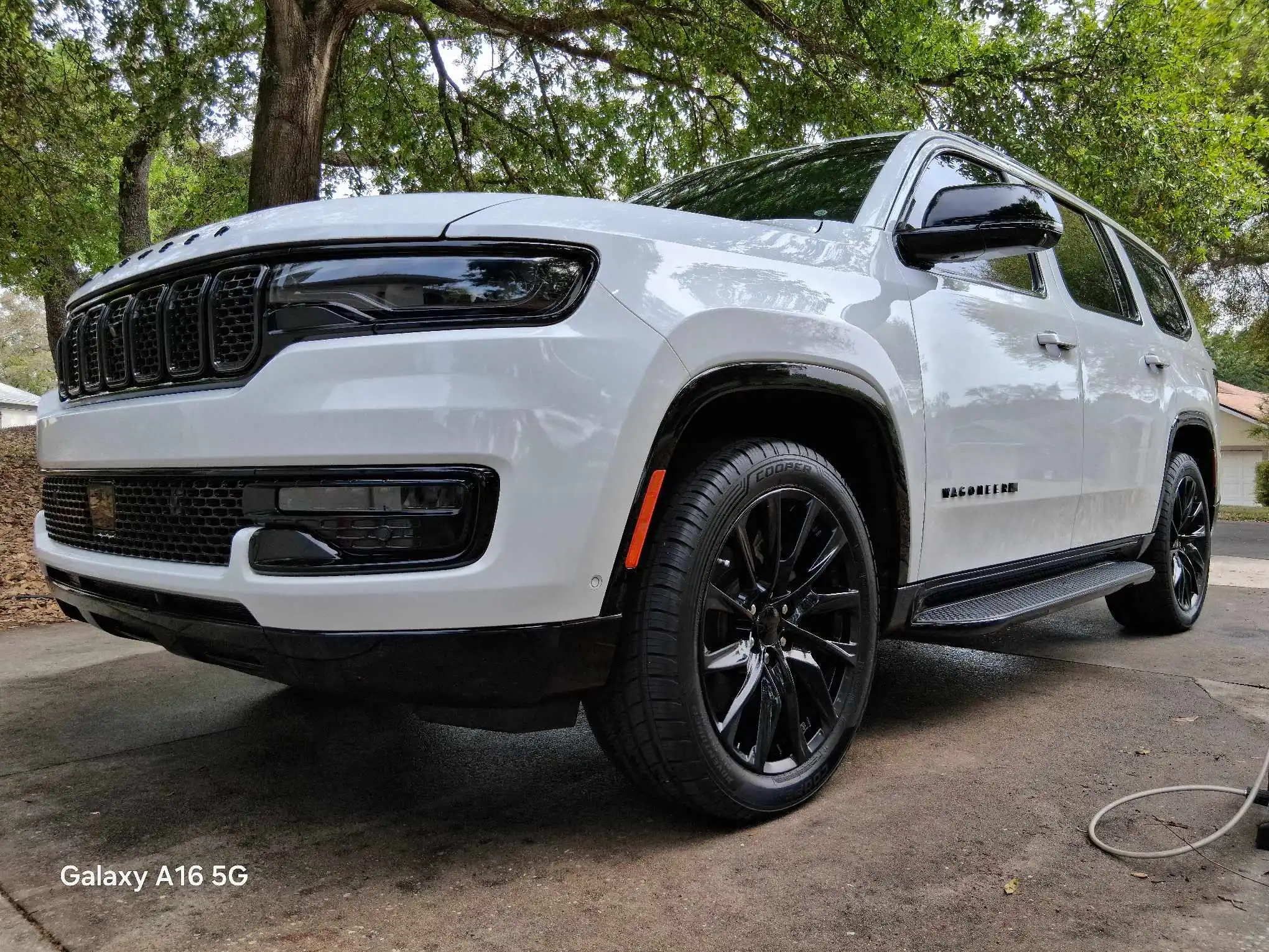 White Jeep Compass Altitude exterior detailing with ceramic coating and black accent wheels